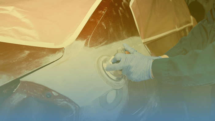 person sanding car 