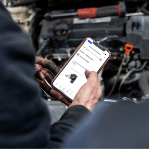 person holding phone with Today's Class training on screen