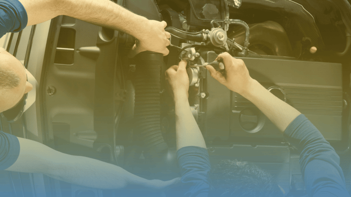 technicians working on engine